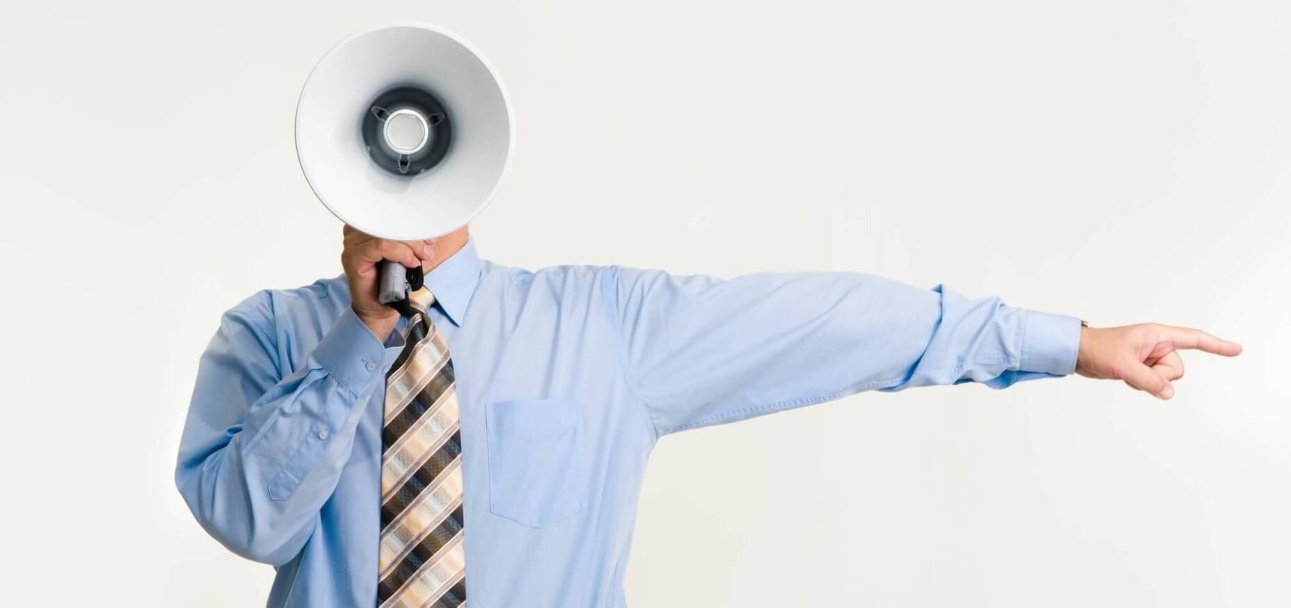 man with megaphone pointing